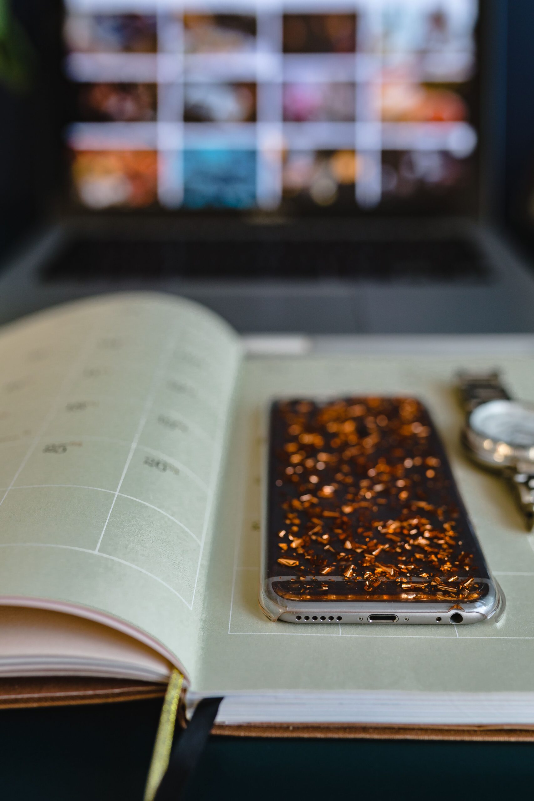 kaboompics_Home office desk with Macbook, iPhone, calendar, watch & organizer (2)